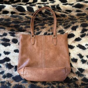 Brown leather tote bag. Brand is ANTIK KRAFT
